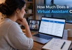 A business owner comparing virtual assistant hourly rates on a spreadsheet with handwritten cost notes beside the laptop.