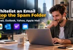 Business owner checking an inbox after learning how to whitelist an email.