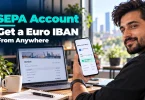 agency founder holding a smartphone displaying fictional euro account details and SEPA payment acceptance, illustrating how to get a euro IBAN from anywhere.